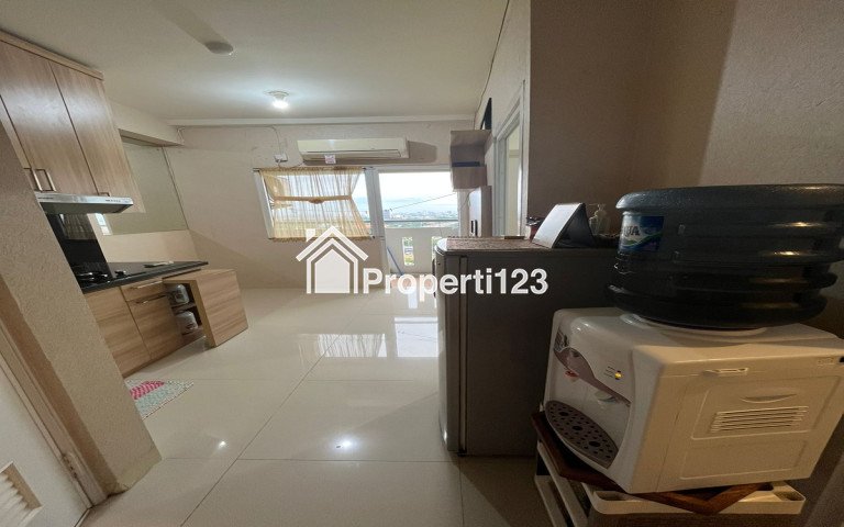 Apartemen the green pramuka city 2 kamar full furnish - 1